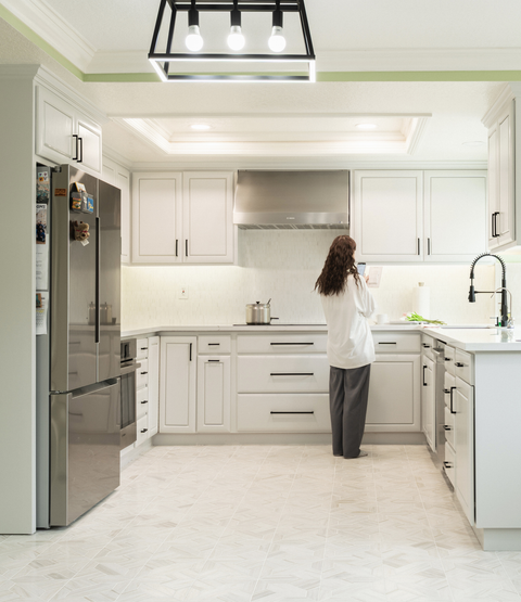 Real Estate Light and Airy Marble Tile in Kitchen Floor and Backsplash photo with girl